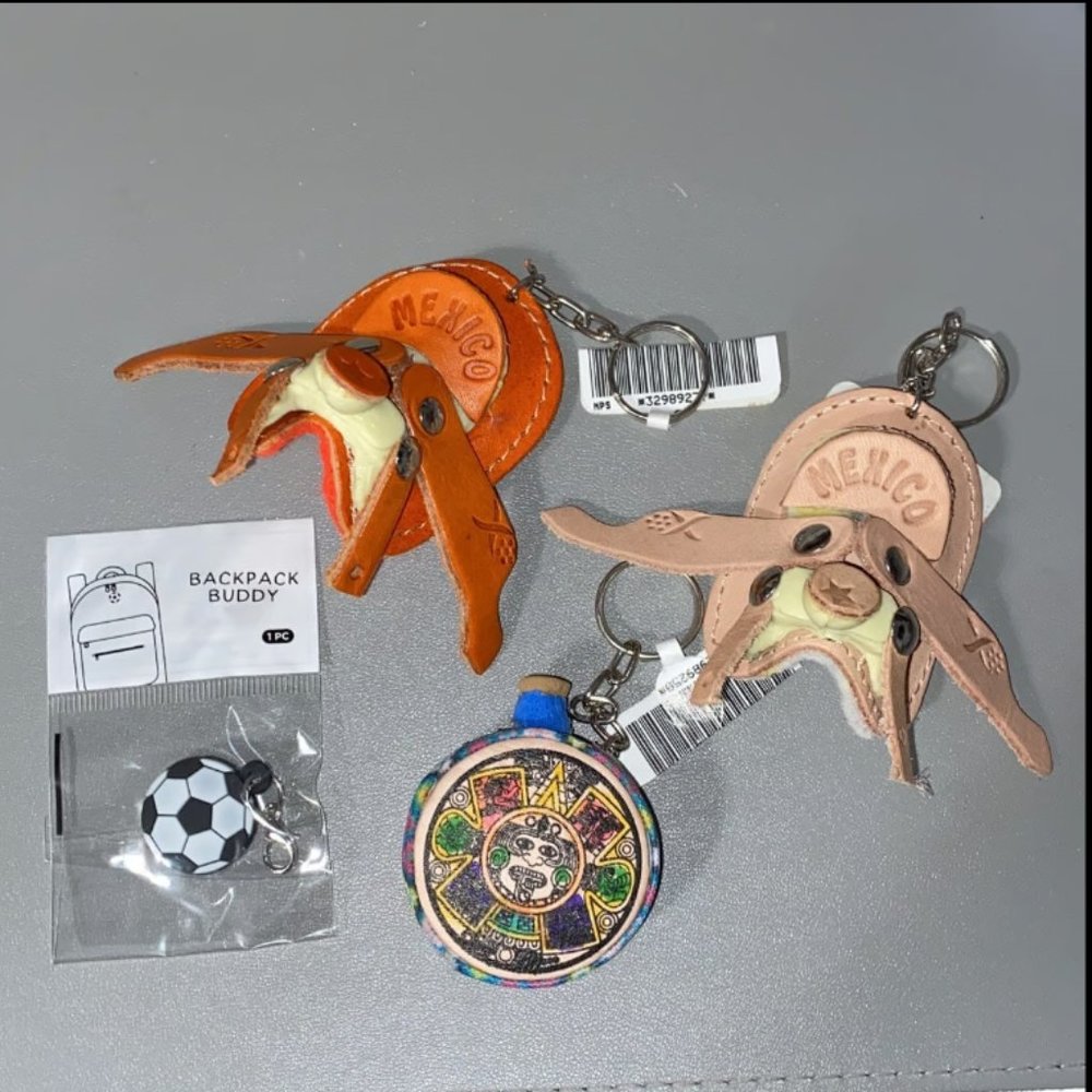 Random assortment of 4 unique keychains, Mexico horse saddles, drum, & soccer